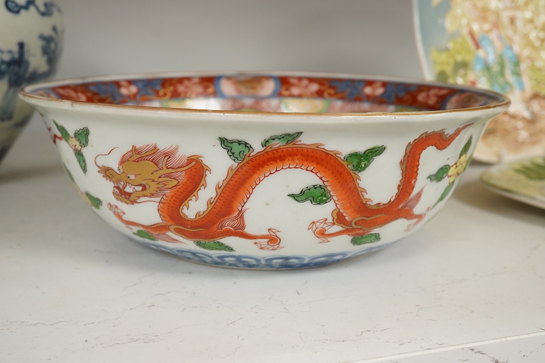 A pair of Chinese blue and white pear shaped vases, a similar jar and a Japanese bowl, largest 23cm in diameter